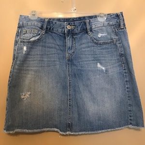 Distressed denim skirt.